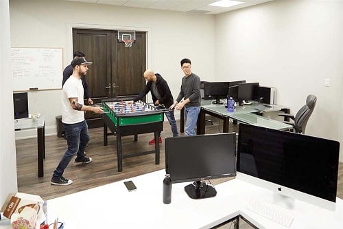 Startup Men Playing Foosball