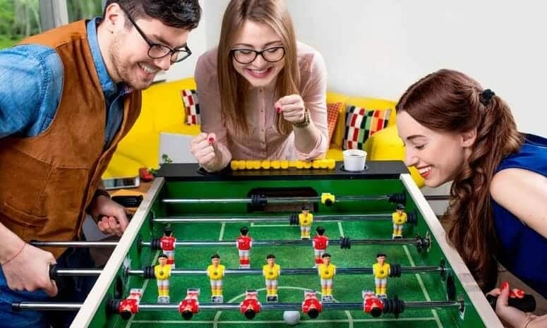 Friends Playing Foosball